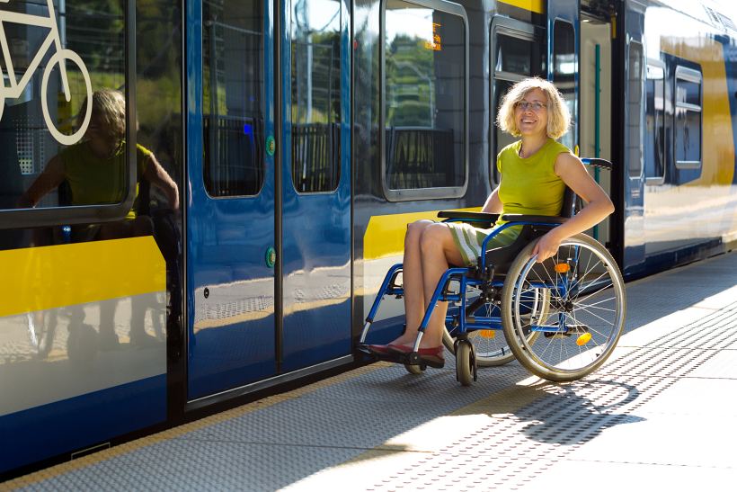 Wheelchair user outside train