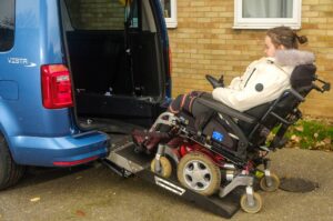 Jessica 2 Woman in wheelchair entering a vehicle via a ramp