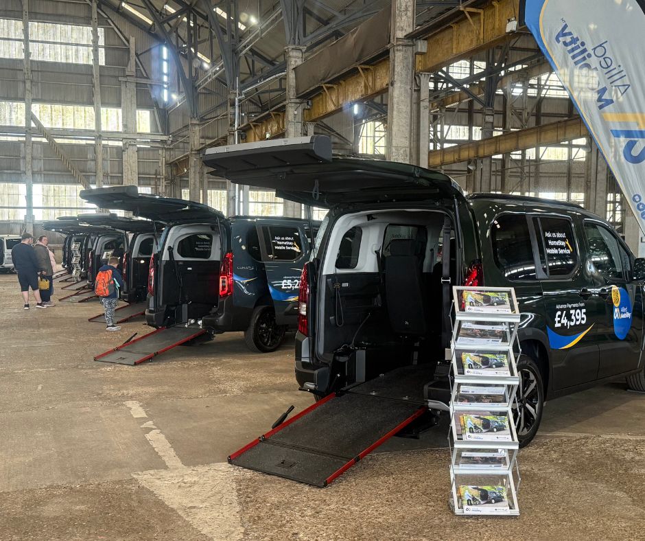 Line of Allied Mobility Wheelchair Accessible Vehicles (WAVs) lined up with ramps down displayed inside the Historic Dockyard Chatham where Allied Mobility held their fully free accessible event for their customers.