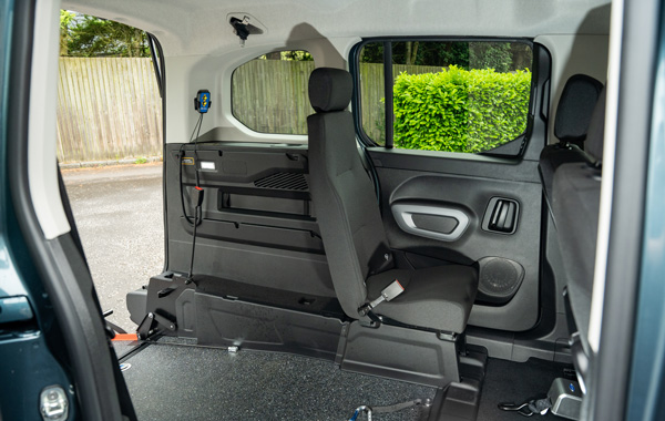 Single passenger seat in wheelchair channel