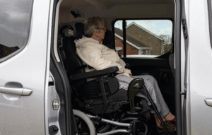 Allied Mobility customer Arlene Hutchinson sits in the second row of Peugeot Horizon in her powerchair.