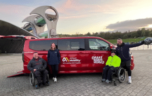 Allied Mobility's Rebecca stands in front of a red Ford Independence with Joanna and Graham from Spinal Injuries Scotland and Grado from Heart Scotland.