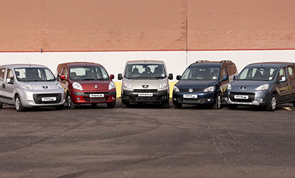 Five wheelchair accessible vehicles parked in a row, including Peugeot and Renault WAV models.